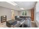 Comfortable basement living area with a plush sectional sofa and natural light, perfect for relaxation at 420 Windswept Ct, Roswell, GA 30075