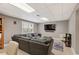 This finished basement offers a cozy living area with ample seating and natural light at 420 Windswept Ct, Roswell, GA 30075