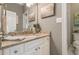 Bathroom featuring granite countertops, soft grey paint and white tile floors at 420 Windswept Ct, Roswell, GA 30075