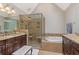 Spacious bathroom with and vanities, walk-in shower and soaking tub at 420 Windswept Ct, Roswell, GA 30075
