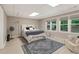 Spacious bedroom with natural light and neutral colors, providing a comfortable and inviting atmosphere at 420 Windswept Ct, Roswell, GA 30075