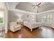 Spacious bedroom with hardwood floors, tray ceiling and great natural light at 420 Windswept Ct, Roswell, GA 30075