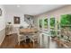 Dining room features hardwood floors, access to the back deck, and a staircase at 420 Windswept Ct, Roswell, GA 30075