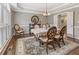 Formal dining room with elegant furnishings, hardwood floors, and a chandelier at 420 Windswept Ct, Roswell, GA 30075