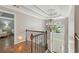Bright foyer featuring a chandelier and an elegant staircase at 420 Windswept Ct, Roswell, GA 30075