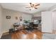 Functional home office with hardwood floors, built-in storage, and a window for a bright workspace at 420 Windswept Ct, Roswell, GA 30075