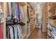 Large walk-in closet with custom shelving and plenty of storage space at 420 Windswept Ct, Roswell, GA 30075