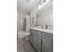 Contemporary bathroom featuring a gray vanity with sleek hardware and a tiled shower-tub combination at 4200 Legacy Ln # 22, Acworth, GA 30101