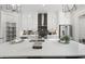 Bright, modern kitchen featuring white cabinets, stainless steel appliances, and a large quartz island at 4200 Legacy Ln # 22, Acworth, GA 30101