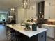Bright kitchen featuring a large island, white cabinets, and stainless steel appliances at 4200 Legacy Ln # 22, Acworth, GA 30101