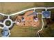 Aerial view of a well-maintained community playground with various play structures and landscaping at 4200 Legacy Ln # 22, Acworth, GA 30101
