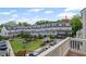 Exterior view of gray townhomes with a central green space, showing a well-maintained community at 4200 Legacy Ln # 22, Acworth, GA 30101