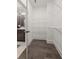 Walk-in closet with custom shelving and hardwood floors at 4200 Legacy Ln # 22, Acworth, GA 30101