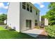 Backyard with a concrete patio and view of lush greenery and the home's siding at 11255 Wittenridge Dr, Alpharetta, GA 30022