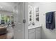 Elegant bathroom with vanity, mirror and artistic wall decor at 11255 Wittenridge Dr, Alpharetta, GA 30022
