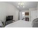 Well-lit bedroom with a large bed and access to a full bathroom at 11255 Wittenridge Dr, Alpharetta, GA 30022
