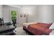 Comfortable bedroom with desk area, well-lit by a window, perfect for study or relaxation at 11255 Wittenridge Dr, Alpharetta, GA 30022