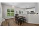 Charming dining area featuring hardwood floors and a view of the outdoors, perfect for meals at 11255 Wittenridge Dr, Alpharetta, GA 30022