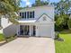 Charming two-story home with a well-manicured lawn and a welcoming front porch area at 11255 Wittenridge Dr, Alpharetta, GA 30022
