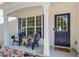 Inviting front porch featuring comfortable seating and a stylish door with a glass window at 11255 Wittenridge Dr, Alpharetta, GA 30022
