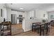 Modern kitchen features stainless steel appliances, white cabinetry and breakfast bar at 11255 Wittenridge Dr, Alpharetta, GA 30022