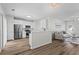 Open concept living space features hardwood floors that connect the kitchen and the living room at 11255 Wittenridge Dr, Alpharetta, GA 30022