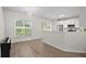 Open concept living space with hardwood floors adjacent to the kitchen and plenty of natural light at 11255 Wittenridge Dr, Alpharetta, GA 30022