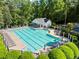 Aerial view of a sparkling community pool surrounded by lounge chairs and lush landscaping at 11255 Wittenridge Dr, Alpharetta, GA 30022