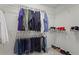 Well-organized walk-in closet with ample storage space for clothing, shoes, and accessories at 11255 Wittenridge Dr, Alpharetta, GA 30022