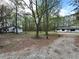 Wide view of property showing the house and separate dwelling at 12778 Cumming Hwy, Canton, GA 30115