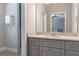 Modern bathroom featuring a neutral color scheme with a vanity, mirror, and tile shower at 2370 Bradwardine Ct, Cumming, GA 30041