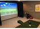 Recreational room with a golf simulator and a 'Masters' banner at 2370 Bradwardine Ct, Cumming, GA 30041