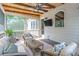 Relaxing screened porch with comfortable seating, ceiling fan, and wood ceiling at 2370 Bradwardine Ct, Cumming, GA 30041