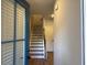Inviting entryway featuring stairs with wooden handrail, leading to the upper level and brightened by a side window at 2409 Malster Ln, Lawrenceville, GA 30043