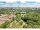 Aerial view of a neighborhood featuring trees, houses, and the city skyline at 3200 Seven Pines Ct # 103, Atlanta, GA 30339