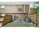 View of the back of the house showing a wooden deck, sliding glass door, and an AC unit at 3200 Seven Pines Ct # 103, Atlanta, GA 30339
