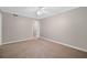 Bedroom with neutral walls, carpet, and access to additional rooms at 3200 Seven Pines Ct # 103, Atlanta, GA 30339