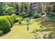 Well-maintained community green space features mature trees and manicured landscaping at 3200 Seven Pines Ct # 103, Atlanta, GA 30339