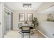 Bright dining area with modern lighting, glass table, stylish chairs, and sliding glass door to the outdoors at 3200 Seven Pines Ct # 103, Atlanta, GA 30339
