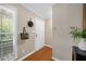 Welcoming entryway featuring hardwood floors and ample natural light through a window at 3200 Seven Pines Ct # 103, Atlanta, GA 30339