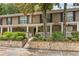 Inviting townhome with well-maintained landscaping, stone accents, and a cozy front porch at 3200 Seven Pines Ct # 103, Atlanta, GA 30339
