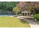 Relaxing community gazebo with picnic table near the tennis court, nestled among lush greenery at 3200 Seven Pines Ct # 103, Atlanta, GA 30339