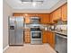 Well-equipped kitchen with stainless steel appliances, granite counters, and ample cabinet space at 3200 Seven Pines Ct # 103, Atlanta, GA 30339