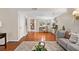 Spacious living area featuring hardwood floors, and an open view to a study area at 3200 Seven Pines Ct # 103, Atlanta, GA 30339