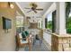 Inviting covered porch with seating and ceiling fan, perfect for relaxing outdoors at 3200 Seven Pines Ct # 103, Atlanta, GA 30339