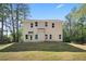 The back of the house has a door and several windows at 3902 Bouldercrest Se Rd, Ellenwood, GA 30294