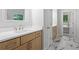 Bathroom featuring double vanities, a clean white countertop, and plenty of storage space at 3902 Bouldercrest Se Rd, Ellenwood, GA 30294