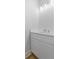 Bright bathroom featuring a white vanity with modern hardware and sleek countertop at 3902 Bouldercrest Se Rd, Ellenwood, GA 30294