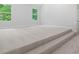Large bonus room with plush carpeting and ample natural light at 3902 Bouldercrest Se Rd, Ellenwood, GA 30294