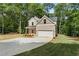 Two-story brick home featuring an attached garage and a wide driveway at 3902 Bouldercrest Se Rd, Ellenwood, GA 30294